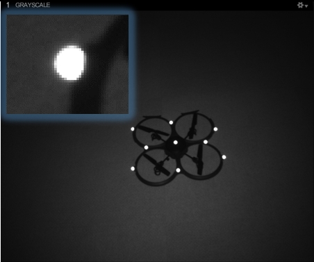 An image taken from an OptiTrack camera in Object mode, with an inset close-up of a single marker.